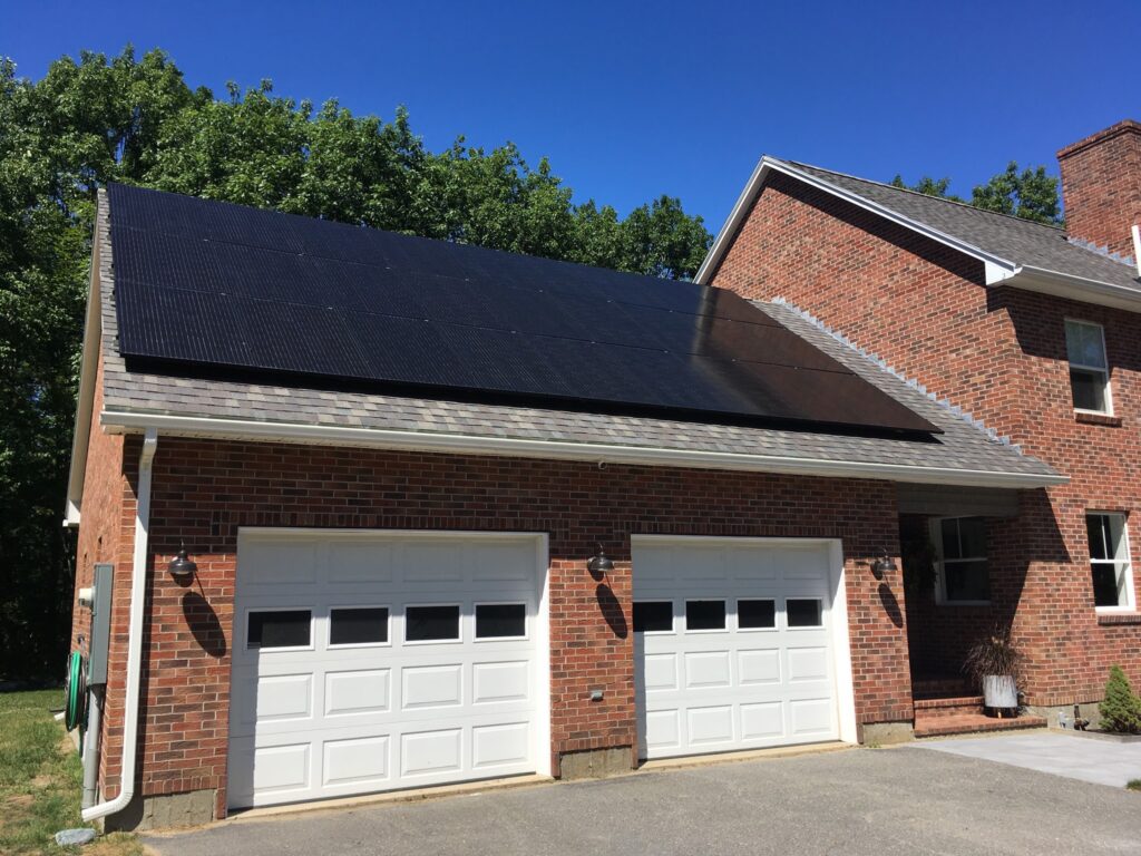 Photo of home garage with solar panels on roof