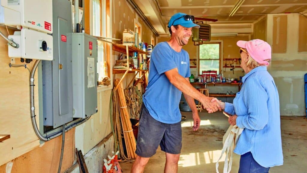 Homeowner meeting with a solar installer in Maine — questions to ask before installing solar panels.